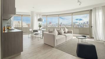 Deluxe Apartment | Living area | TV