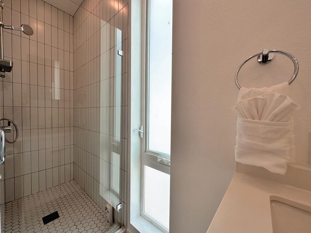 Shower, towels, shampoo, toilet paper