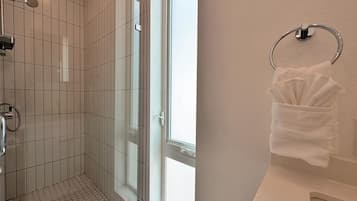 Shower, towels, shampoo, toilet paper