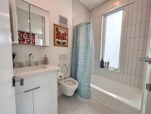 Shower, towels, shampoo, toilet paper
