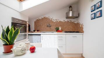 Fridge, oven, coffee/tea maker, cookware/dishes/utensils