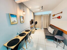 Apartment, 1 Bedroom | Living area | 40-inch TV with digital channels