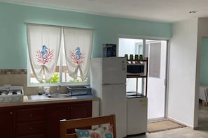Fridge, microwave, stovetop, coffee/tea maker