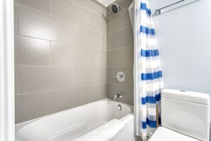 Luxury Condo | Bathroom | Combined shower/tub, free toiletries, hair dryer, towels