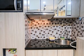 Deluxe Apartment | Private kitchen | Full-sized fridge, stovetop, rice cooker, cookware/dishes/utensils - Best Choice 2Br Apartment At Taman Melati Jatinangor (Hegarmanah)