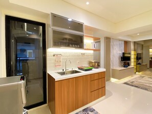 Deluxe Apartment | Private kitchen | Full-sized fridge, stovetop, rice cooker, cookware/dishes/utensils - Comfortable Designed And Best Deal 2Br At Meikarta Apartment (Cikarang)