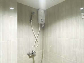 Deluxe Apartment | Bathroom | Shower, towels, shampoo - Homey And Best Deal Studio At Vasanta Innopark Apartment (Cikarang)