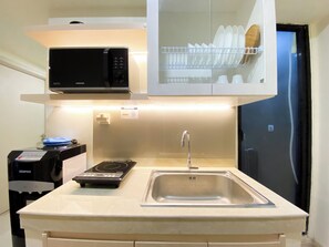 Deluxe Apartment | Private kitchen | Full-size fridge, microwave, stovetop, rice cooker - Best Homey And Modern 2Br At Meikarta Apartment (Cikarang)