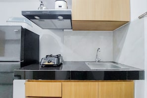 Appartement Deluxe | Cuisine privée | Réfrigérateur grande capacité avec congélateur, surface de cuisson