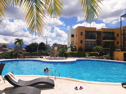 Modern apartment located in a resort style condo, pools, jacuzzi, soccer field,.