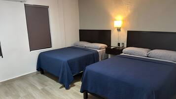 Habitación Deluxe | Ropa de cama de alta calidad, edredón y camas Select Comfort