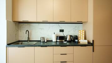 Deluxe Apartment | Private kitchen | Full-sized fridge, microwave, dishwasher, toaster