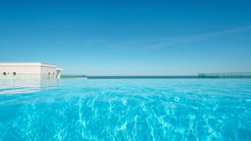 Seasonal outdoor pool, pool umbrellas, pool loungers