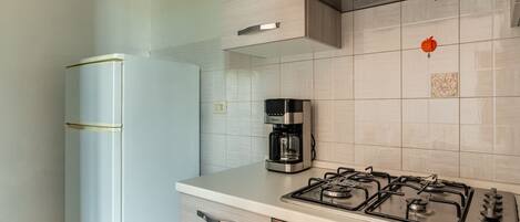 Fridge, coffee/tea maker, electric kettle, cookware/dishes/utensils