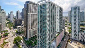 A high-rise building with a modern architectural design, featuring multiple floors with balconies and a central courtyard. - Icon Tower 3 (Miami)