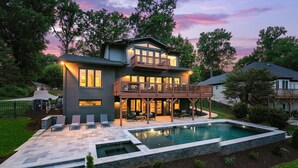A two-story house with a large deck and a swimming pool. - Elysian Shores W/heated Pool & Optional Boat Rental (Mooresville)