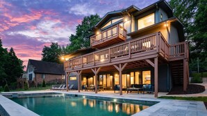 A two-story house with a pool, deck, and outdoor seating area. - Elysian Shores W/heated Pool & Optional Boat Rental (Mooresville)