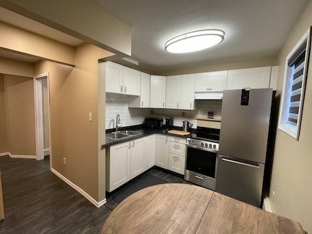 Fridge, microwave, oven, stovetop. Cozy Furnished Apartment