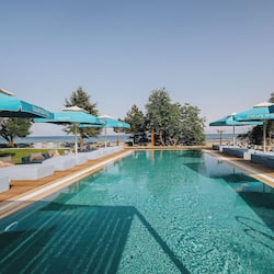 Outdoor pool, pool umbrellas, sun loungers