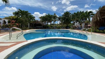 Outdoor pool, open 9:00 AM to 9:00 PM, free cabanas, pool umbrellas
