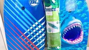 Three beach umbrellas with different designs and colors.