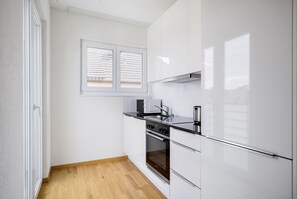 Fridge, microwave, oven, stovetop - Airy Wiedikon 2.5BR w/ W/D & Storage Room, nr Tram, by Blueground (Zurich)