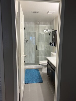 Shower, hair dryer, towels, soap