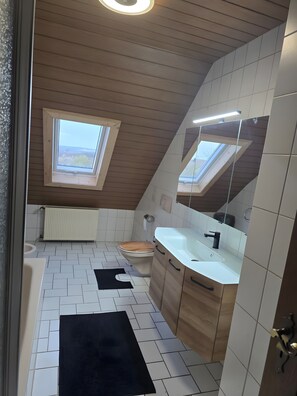 Bathtub, hair dryer, towels