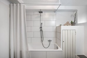 Bathtub, hair dryer, towels