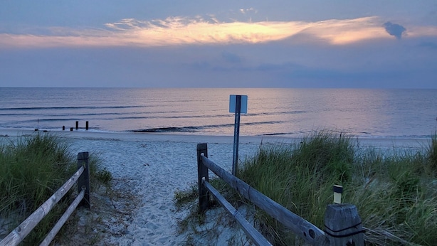 A beach path leading to the ocean with a wooden fence and a signpost. - The Perfect Escape with Gorgeous Heated In-Ground Pool (Lower Township)