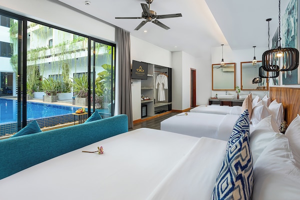 Habitación triple | Vista al jardín