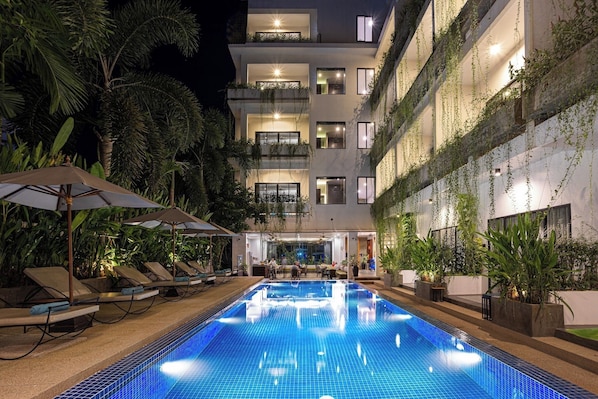 Outdoor pool, open 9:00 AM to 9:00 PM, pool umbrellas, pool loungers