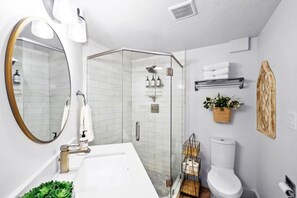 Shower, hair dryer, towels, soap