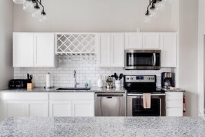 Fridge, microwave, oven, stovetop - Modern 2BR Luxury Condo • Downtown w/ Garage & Gym (Louisville)