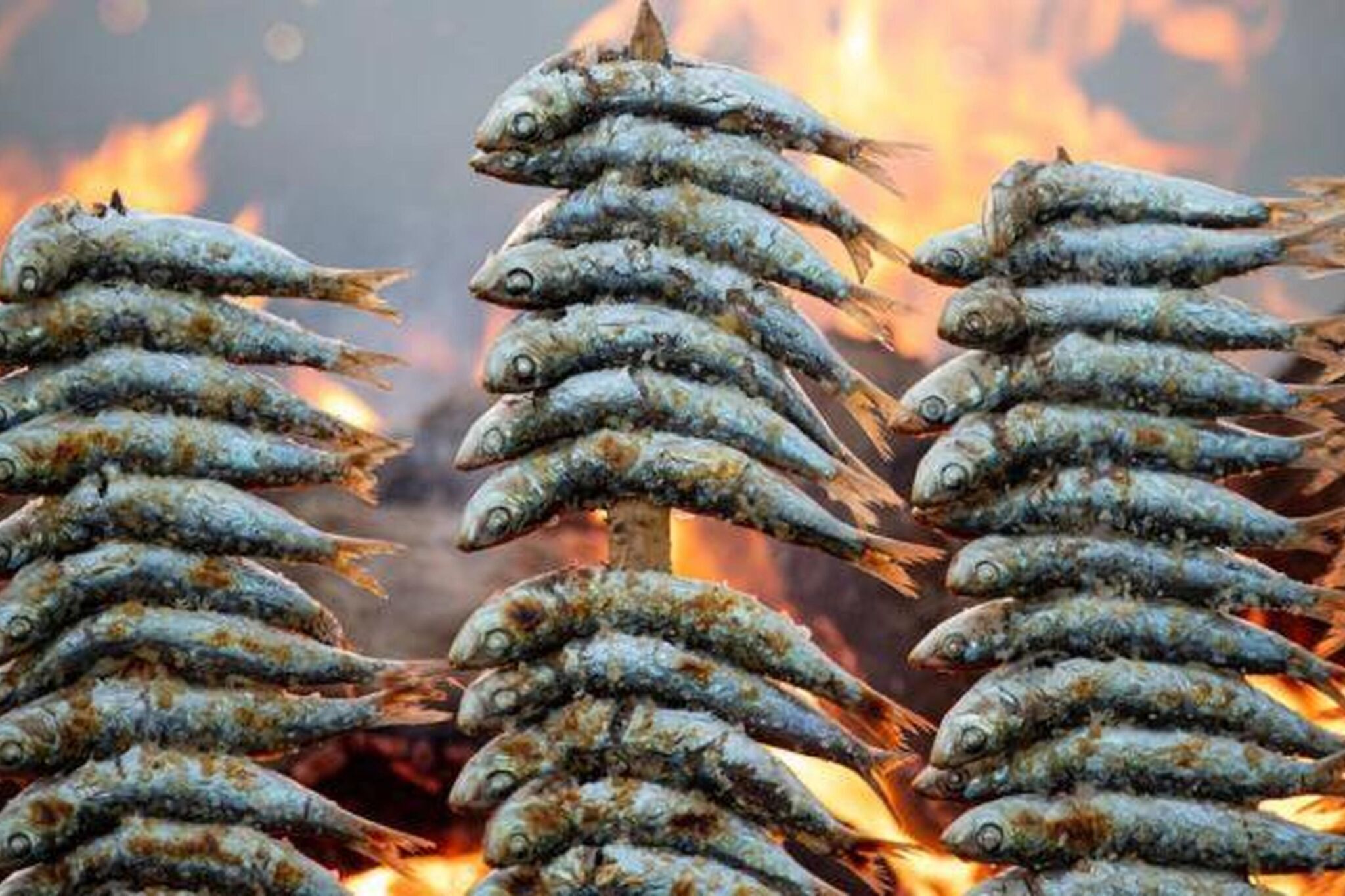 Fisk grilles over åben ild.
