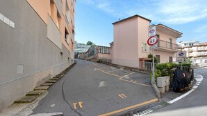 A residential street with a building on the right, a no parking sign, and a pedestrian crossing. - Apartment 'Casa Cogoleto Terrace and Parking' with Sea View, Wi-Fi and Air Conditioning (Cogoleto)