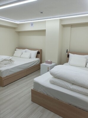 Deluxe Family Room 103 | Premium bedding, down comforters, pillowtop beds, individually decorated