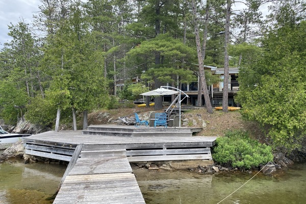 Waterfront Deck and Access to Dock with View of Cottage