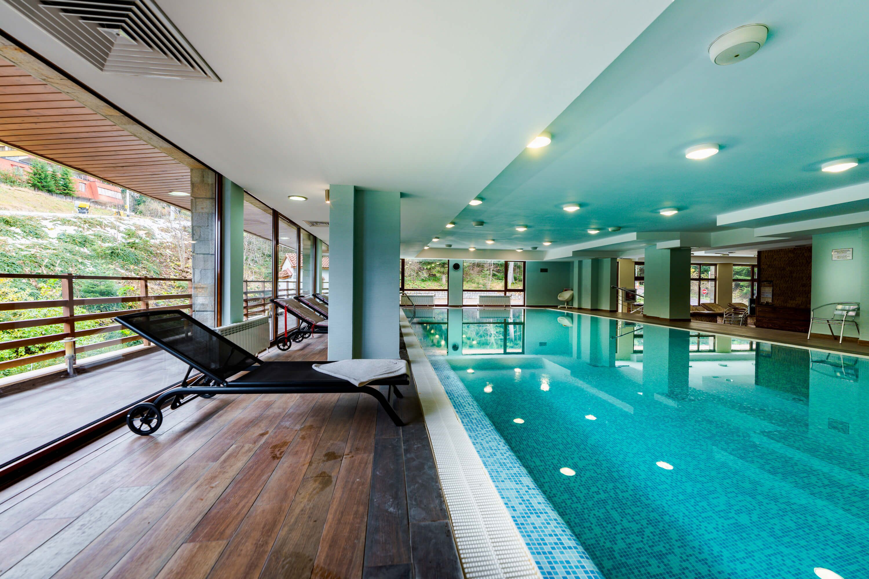 Indoor pool, pool umbrellas, sun loungers