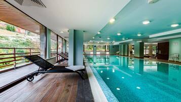 Indoor pool, pool umbrellas, sun loungers