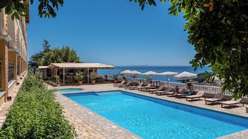 Seasonal outdoor pool, open 7:30 AM to 10:30 PM, pool umbrellas