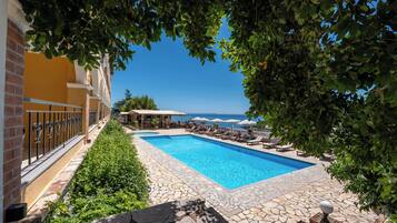 Seasonal outdoor pool, open 7:30 AM to 10:30 PM, pool umbrellas