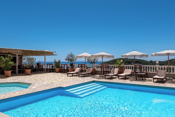 Seasonal outdoor pool, open 7:30 AM to 10:30 PM, pool umbrellas