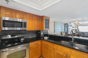 Fridge, microwave, oven, stovetop - #502 Beach Place Condos - Nightly Rental (Madeira Beach)