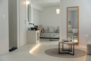 Premium Suite | Living area | 43-inch Smart TV with cable channels, offices