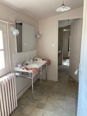 Shower, hair dryer, towels, toilet paper