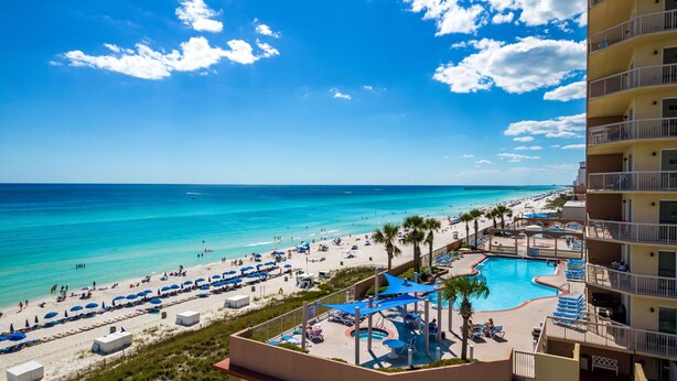A resort with a pool, beach, and ocean view. - REFRESHED CONDO! READY FOR YOU! 3/2 GULF FRONT! SLEEPS 10! (Panama City Beach)