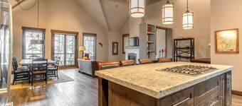 Wilderness retreat with a large deck, grill, updated interior, fireplace, and AC