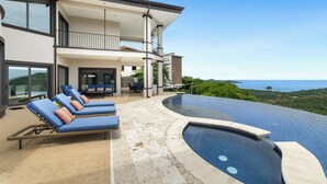 A modern house with a pool, a balcony, and a view of the ocean. - Luxury House in Mar Vista, Flamingo, Cabo Velas (Playa Flamingo)