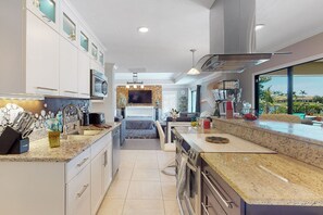 Fridge, microwave, oven, stovetop - Sunny lakefront home with heated saltwater pool, pool spa, grill, patio, kayaks (Bonita Springs)